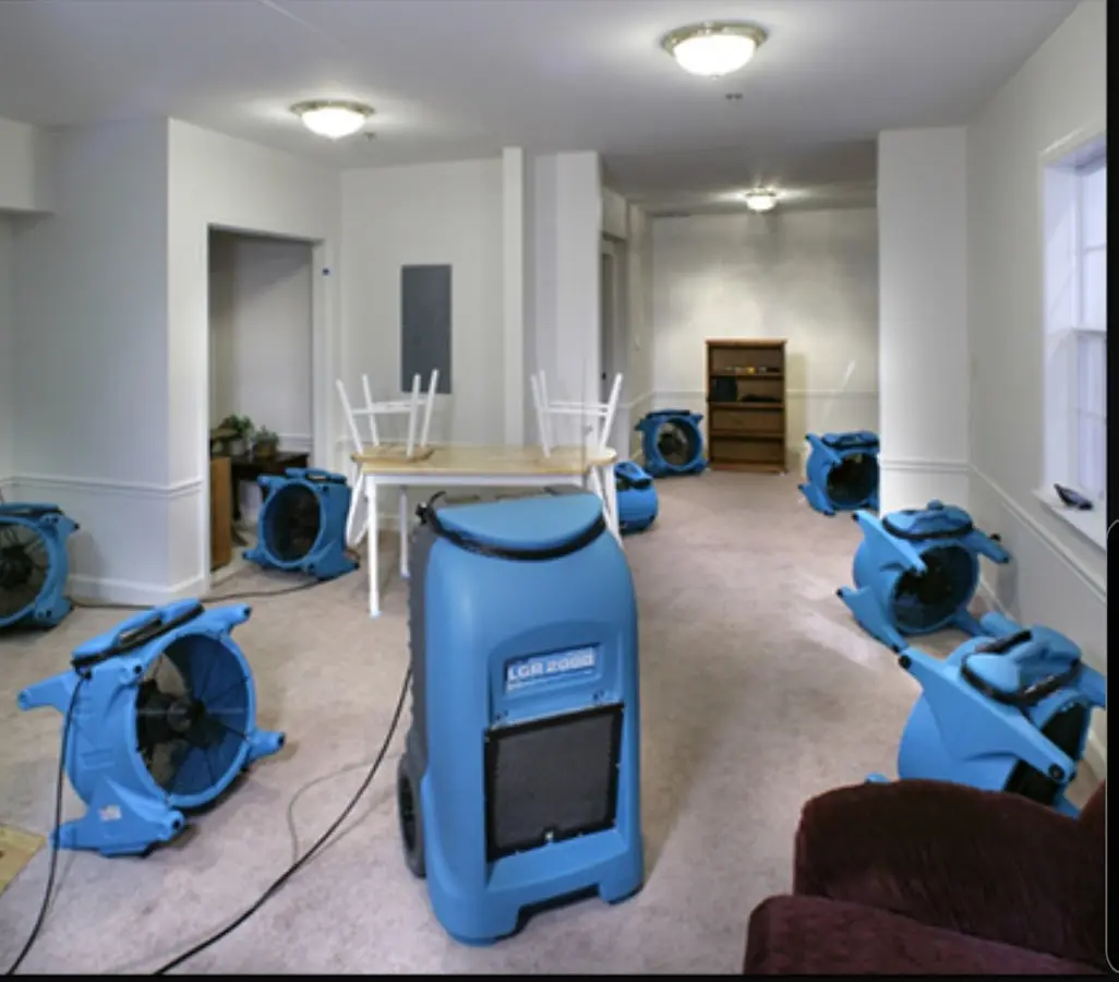 Air movers and dehumidifier setup for Water Damage Restoration in Charlestown